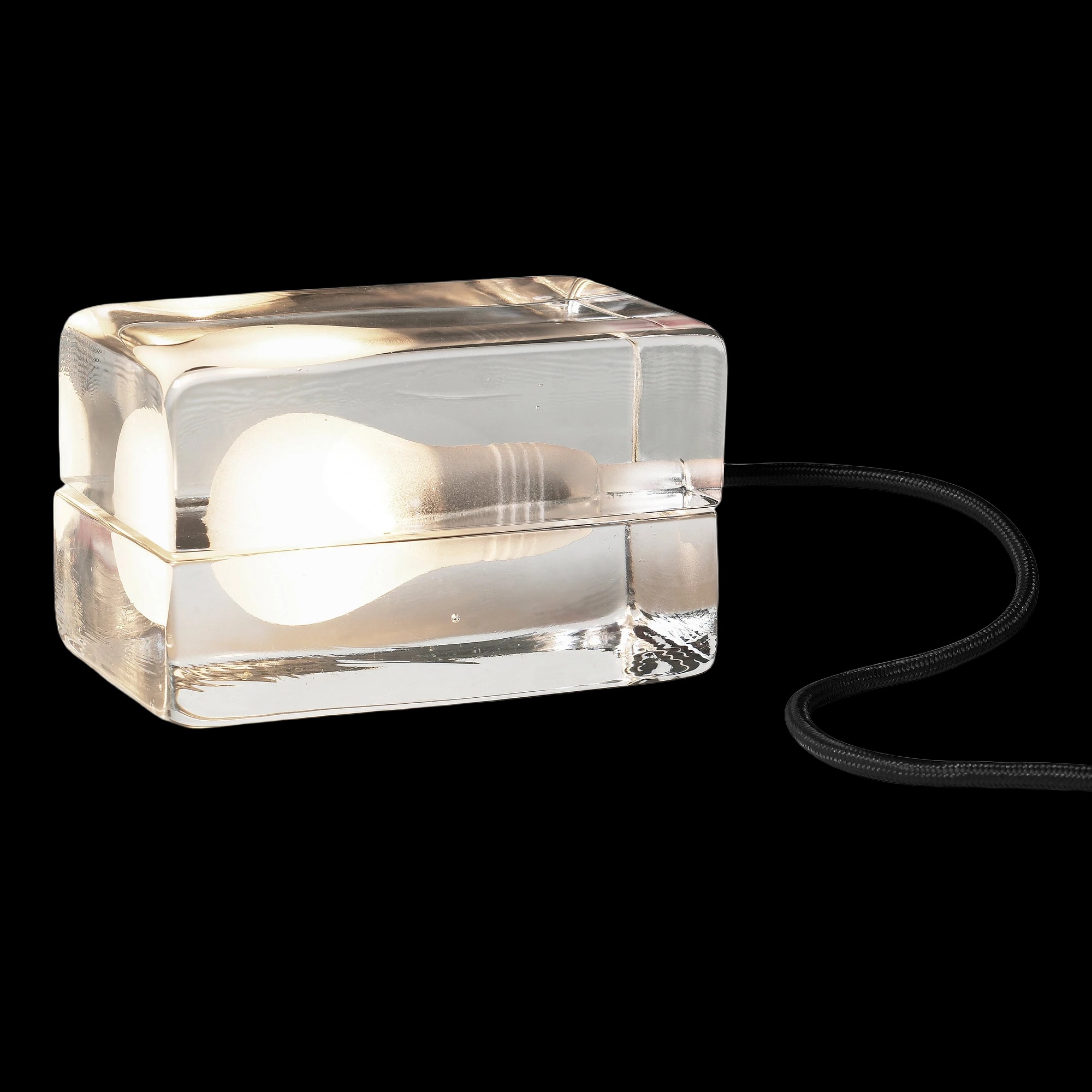 Design House Stockholm Block Lamp — Edison bulb cast in clear glass.