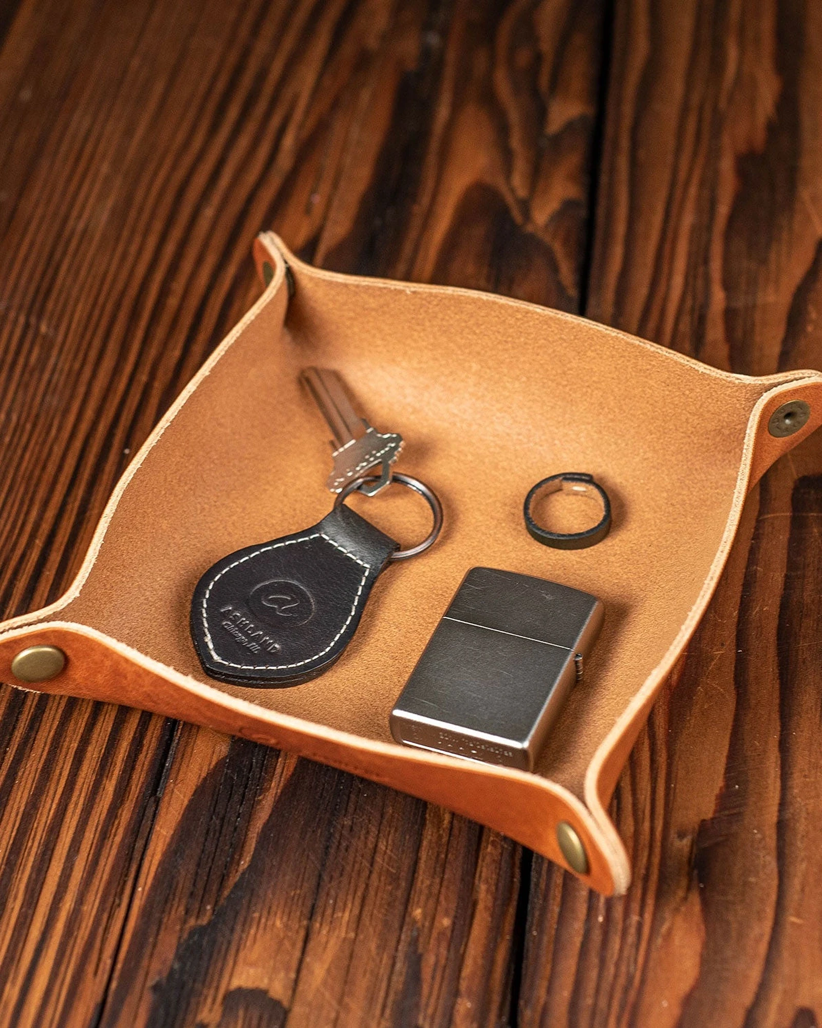 Ashland Leather valet tray in English tan, photographed in a room.